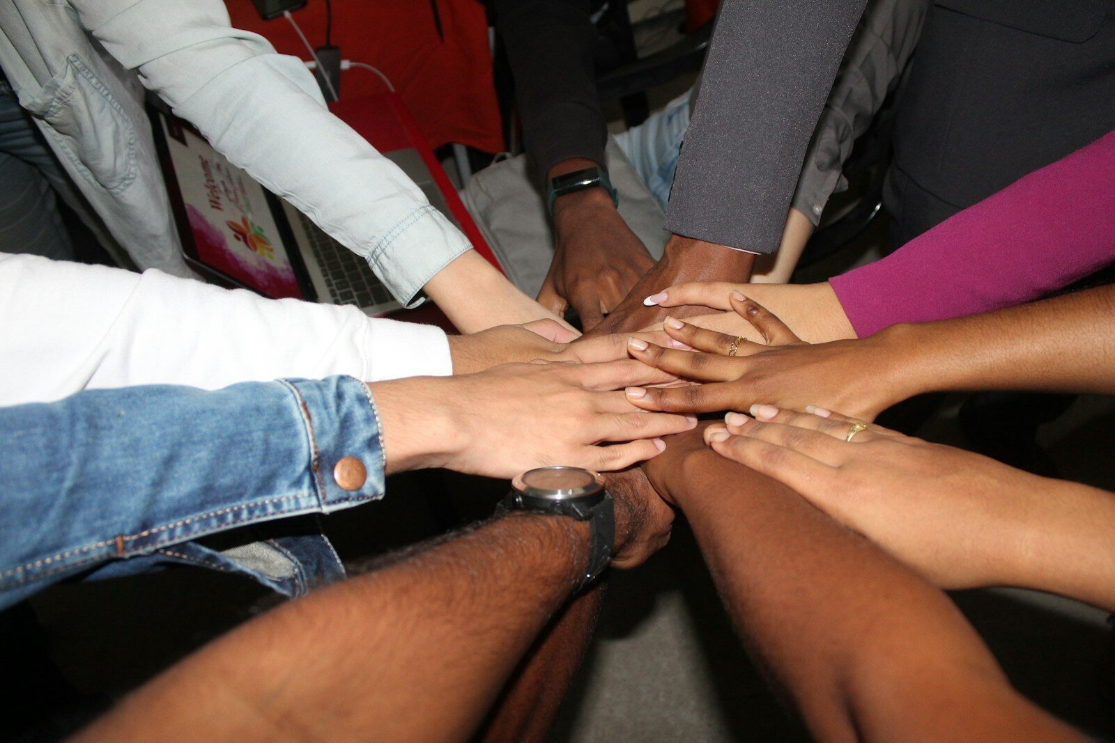 Photo by Rineshkumar Ghirao team stacking hands together in unity